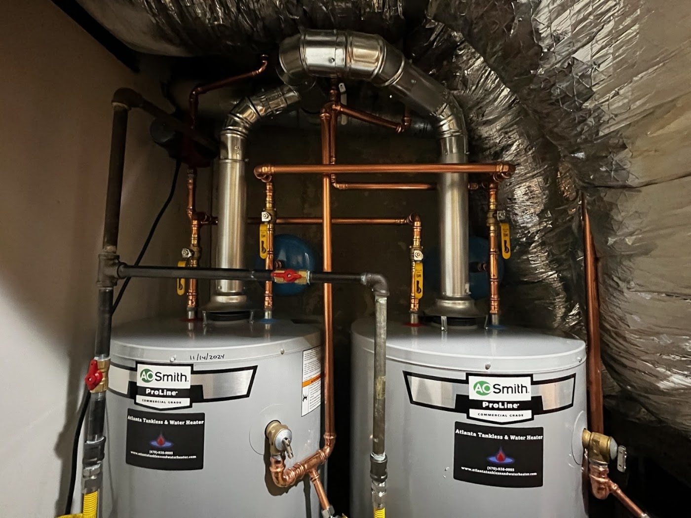 Two tank water heaters with copper plumbing